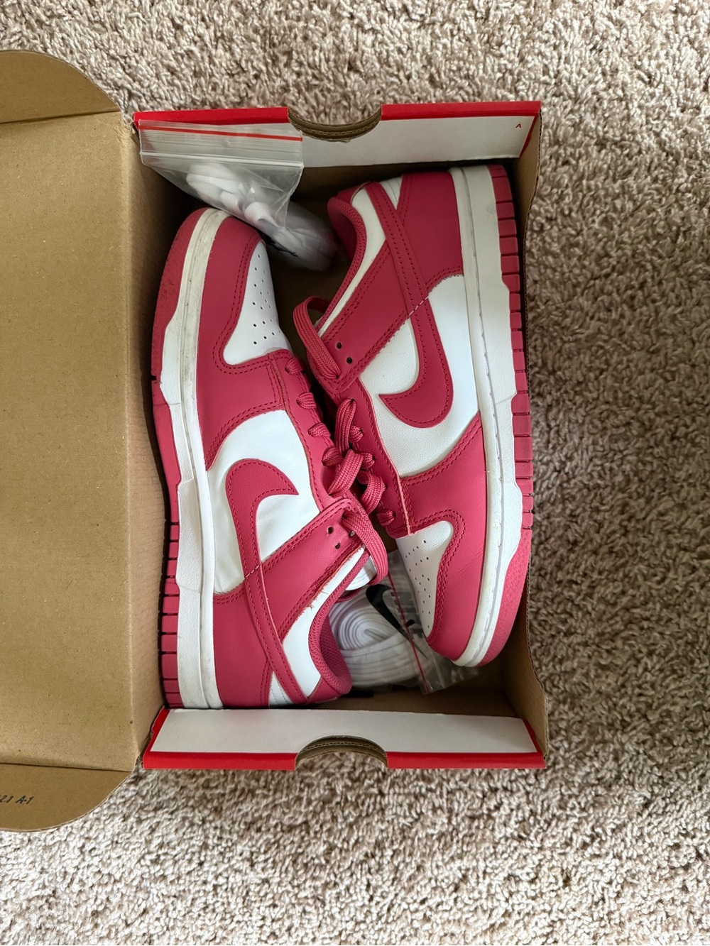 Nike women’s pink Nike Dunk Low’s